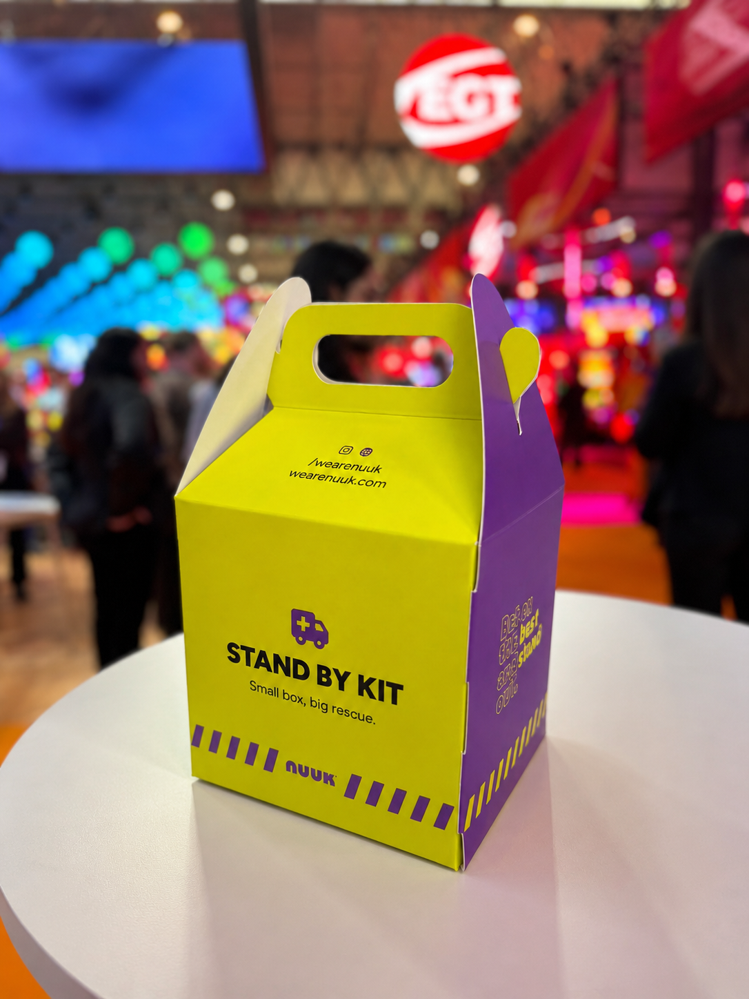 NUUK Stand By Kit box on a table at an exhibition hall